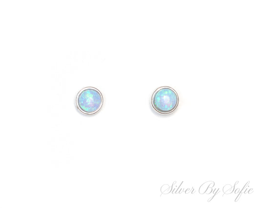 Small circular light blue opal sterling silver stud earrings