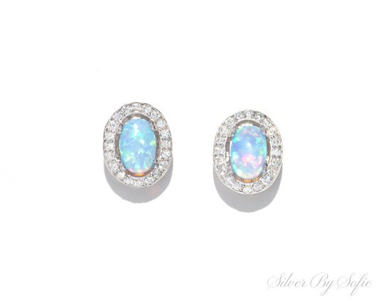 Light blue opal oval shaped sterling silver earrings